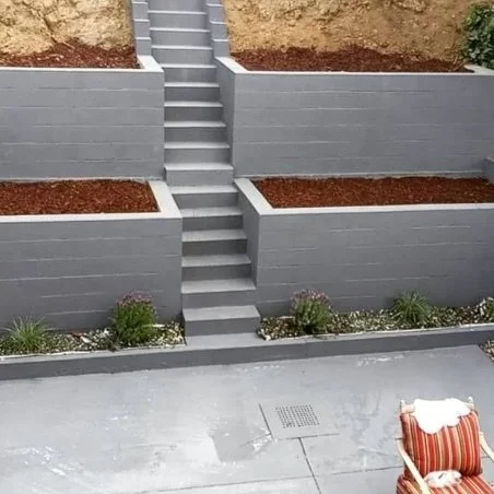 Painted outdoor retaining walls, stairs and concrete patio.